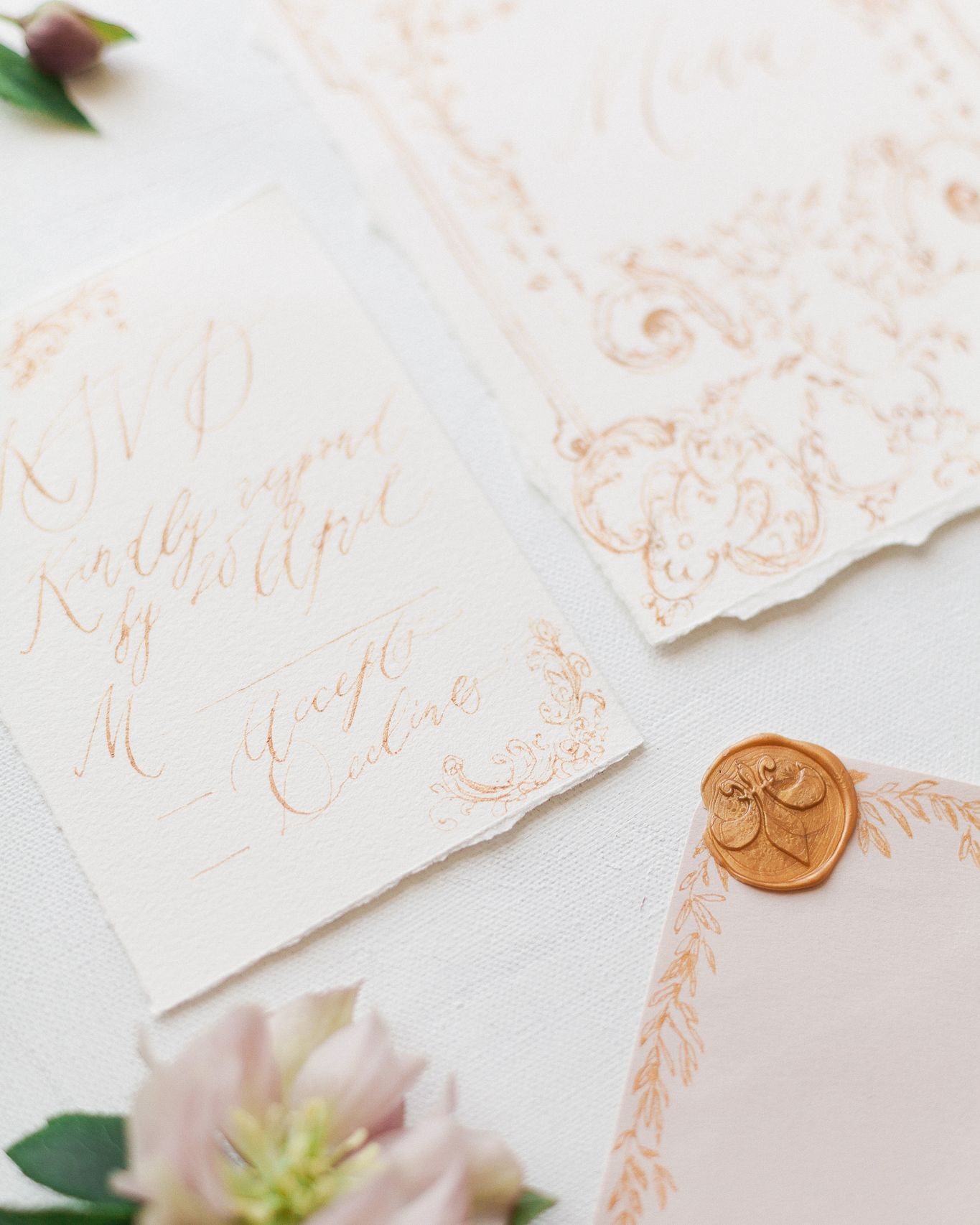 Green invitation with gold foil wreath