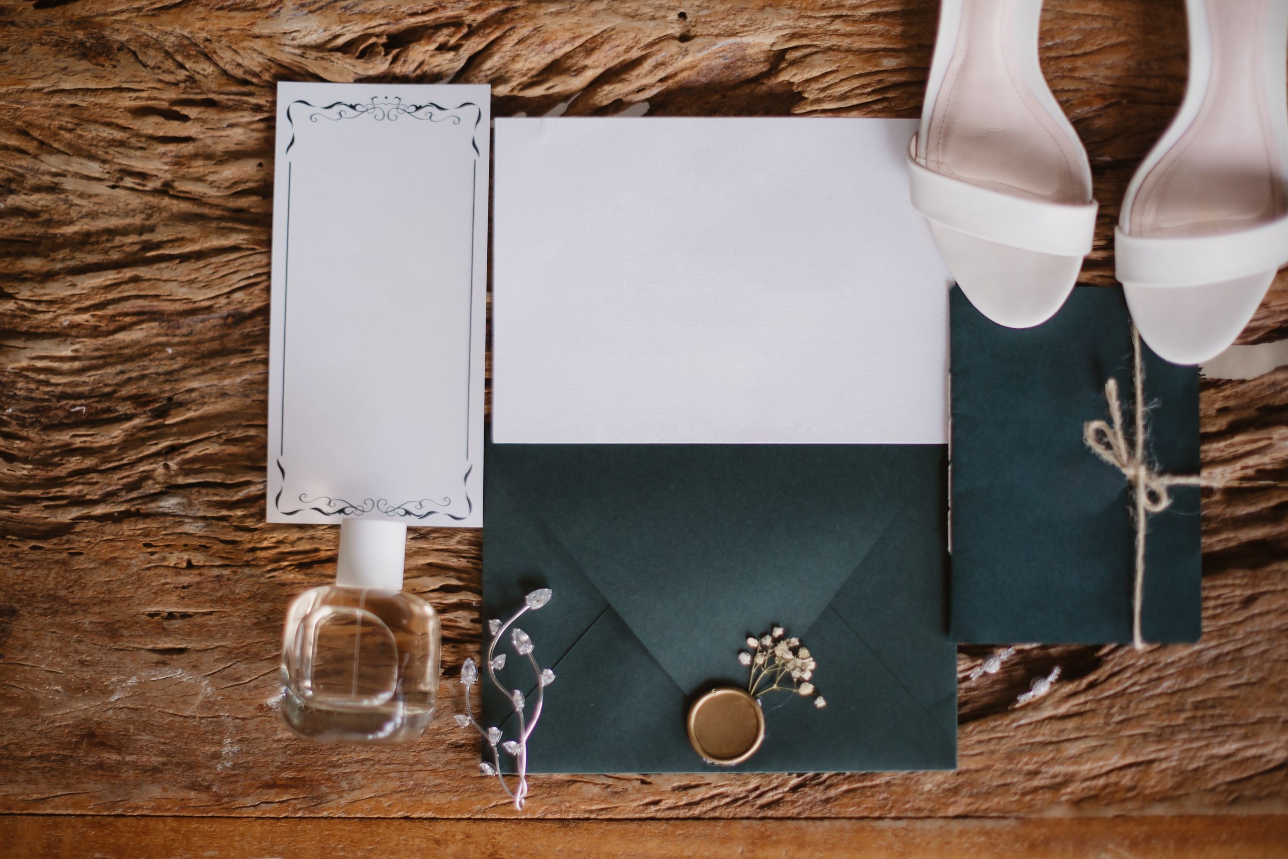 Wedding invitation suite with green envelope and white rose