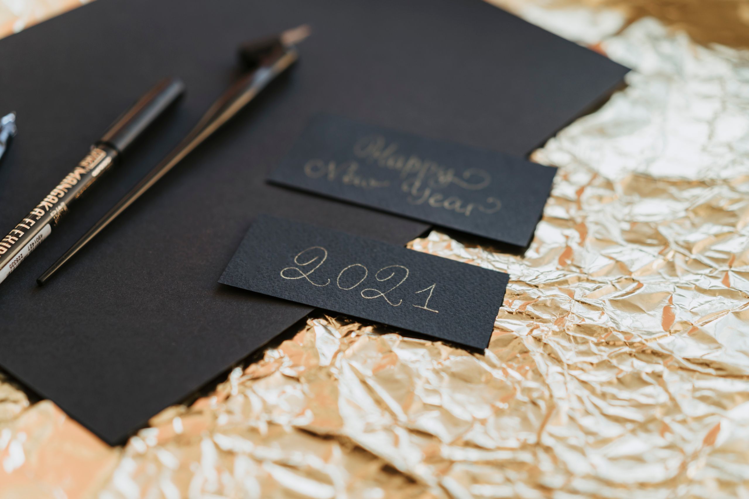 Dark textured business cards with gold foil